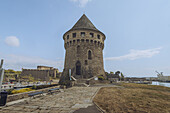 View of the imposing Tour Tanguy, a medieval stone tower with a conical roof, stands proudly against the clear sky, a testament to history and architecture, Brest, Bretagne, France.