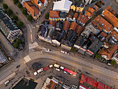 Aerial view of the vibrant Fish Market bustling with activity, contrasting against the backdrop of colorful buildings, Bergen, Vestland, Norway.