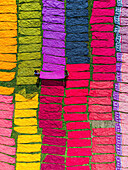 Narayanganj, Bangladesh - 01 October 2023: Aerial view of vibrant textiles stretch across the landscape, a mosaic of color under the sun, creating a breathtaking scene.
