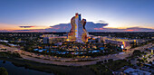 Hollywood, Florida, United States - 14 August 2025: Aerial view of the iconic Guitar Hotel ablaze with vibrant light against the fading twilight.