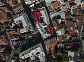 Aerial view of red rooftops contrasting with the narrow streets below, a vibrant tapestry of urban life unfolds from above., Tbilisi, Tbilisi, Georgia.