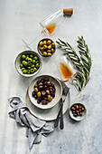 Olive branches, different coloured olives, amber wine