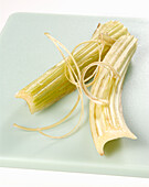 Peeled cardoon stalk on chopping board