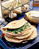 Piadina filled with garlic cream and rocket