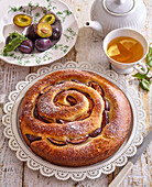 Roll (coiled) cake with plums