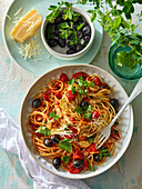 Pasta with tomatoes and olives fast to prepare