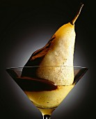Vanilla-flavored poached pear with chocolate sauce