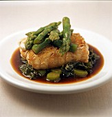 Cod back with asparagus tips and sorrel tips deglazed with soy sauce
