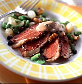 Roasted duck breast with 5 peppers blueberry-bean sauce and glazed onions