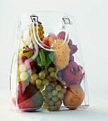 tropical fruit in transparent shopping bag