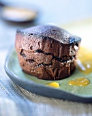 Moist chocolate sponge cake with mango and passion fruit purée