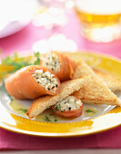 Smoked salmon rolls filled with crab