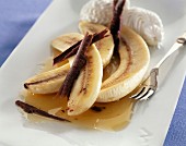 Banana with chocolate and whipped cream