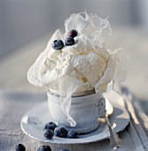 Fontainebleau cheese with frosted blueberries