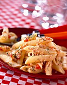 Penne pasta with potted fish