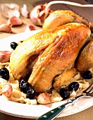 Guinea fowl with black olives