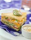 raw vegetable club sandwich with mustard