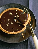 Dark chocolate tartlet with gold flakes