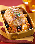 Roast pork with olives, potatoes and bacon