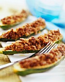 Courgette stuffed with raw ham and mushrooms