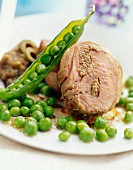 Lamb roll with green olive paste and fresh peas