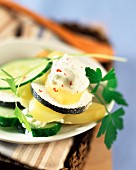 Layered potatoes, cucumber and goat's cheese