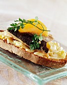 Sardine, tangerine and butter open sandwich