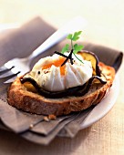 Poached egg with truffles on aubergines