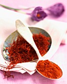 Saffron strings and milled safron on a spoon