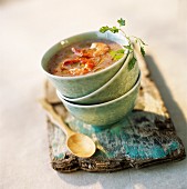 Creamed red rice soup with lemon grass and grilled prawns
