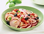 tomato salad, scrambled eggs and red onions