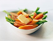 Steam-cooked carrots with a nut of butter