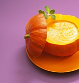 Pumpkin soup served in the pumpkin