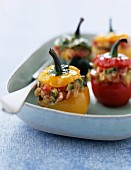 Peppers stuffed with young vegetables, raw ham and ricotta