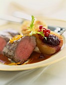 Thick beef steak with poached pear