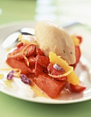 Strawberry, orange and peach fruit salad with pear ice cream
