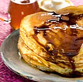 Pile of pancakes with melted chocolate