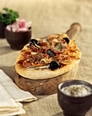 Pizza-style onion, anchovy and olive tart