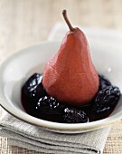 Pear poached in red wine with prunes