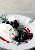 Goat cheese faisselle ice cream with blackcurrant coulis