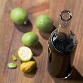 Bottle of walnut wine and fresh walnuts