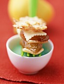 Layered apple tatin, pistachio cream and almond sugar