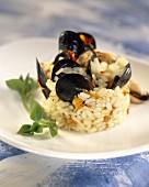Rice in broth, marigolds and mussels