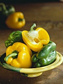 Arrangement of green and yellow peppers