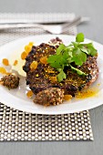 Spicy shoulder of lamb with sultanas