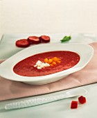 strawberry soup with diced pumpkin and fresh cheese