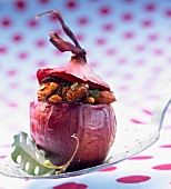 Red onion stuffed with almonds,grapes and honey