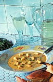 Cream of fish soup with croutons