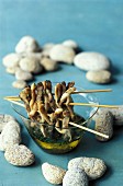 Razor clam skewers with chive vinaigrette