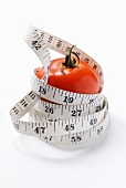 Diet tomato with measuring tape